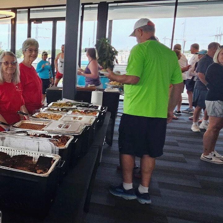 Another view of the buffet line with guests