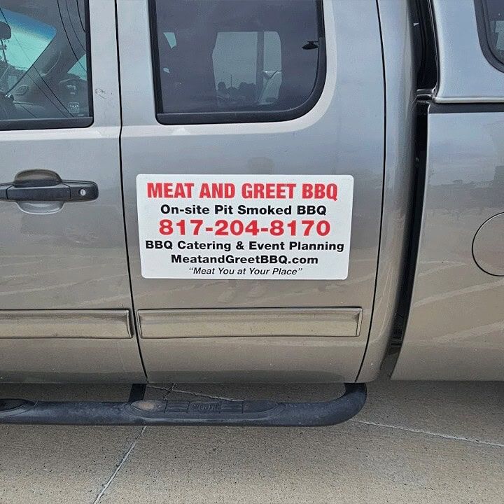 The Meat and Greet BBQ sign on the truck door